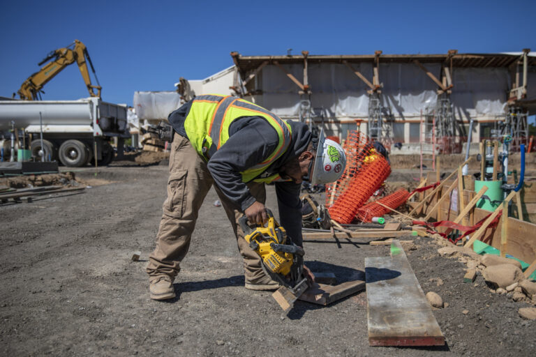 A California housing bill would raise wages to $28. Why do some unions hate it?